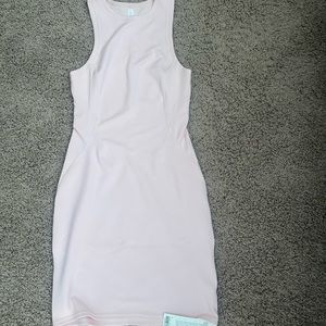 Brand new womens Lululemon ribbed slim fit dress. Size 4.  Pale pink.  NWT